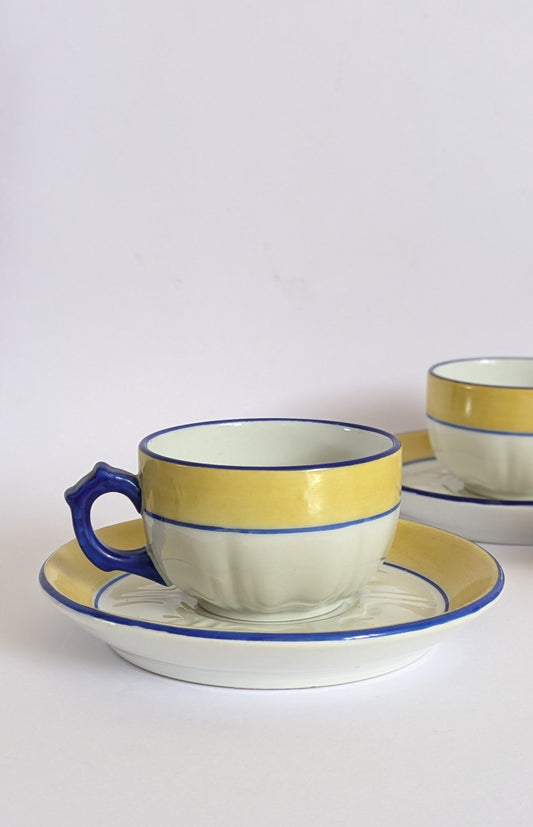 Lot de 4 tasses à café et sous tasses jaunes blanches et bleu en porcelaine de Limoges