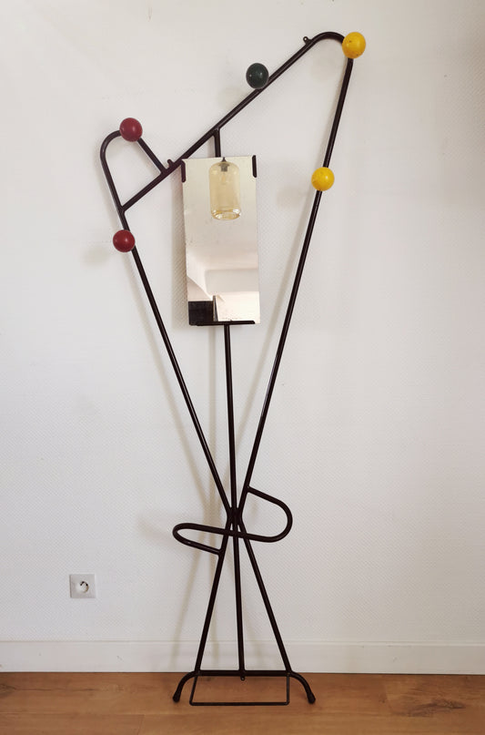 wall-mounted coat rack in the style of Roger Féraud