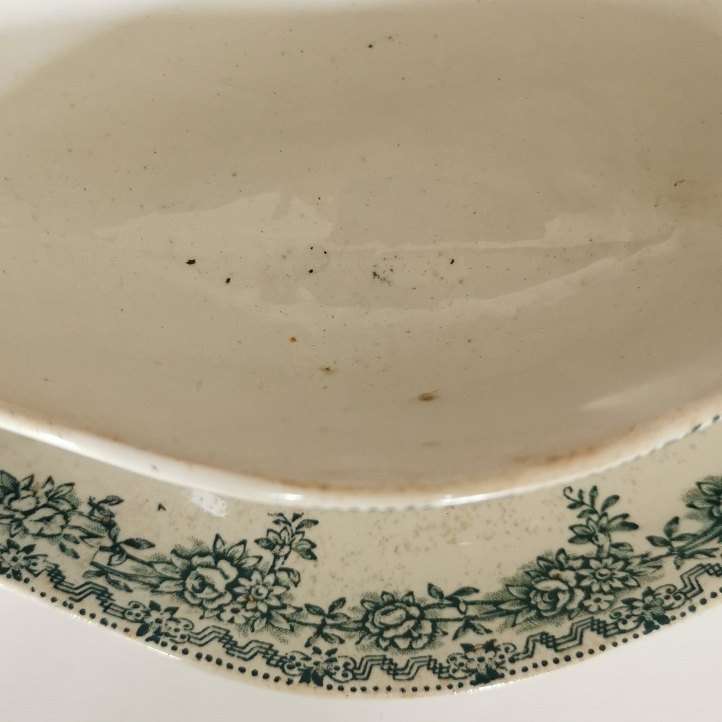 old sauce boat with green decor