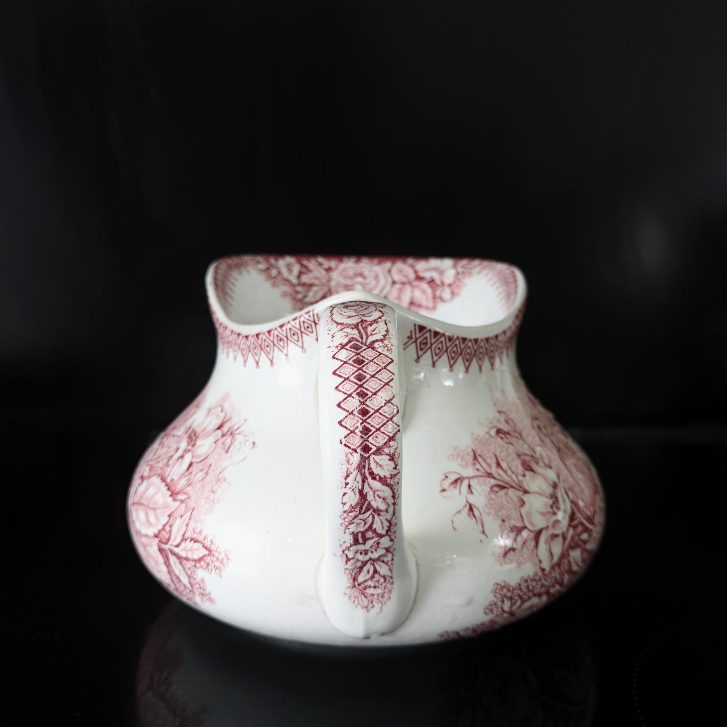 Old pitcher from the Castres earthenware factory with red floral decoration, Jardinière model