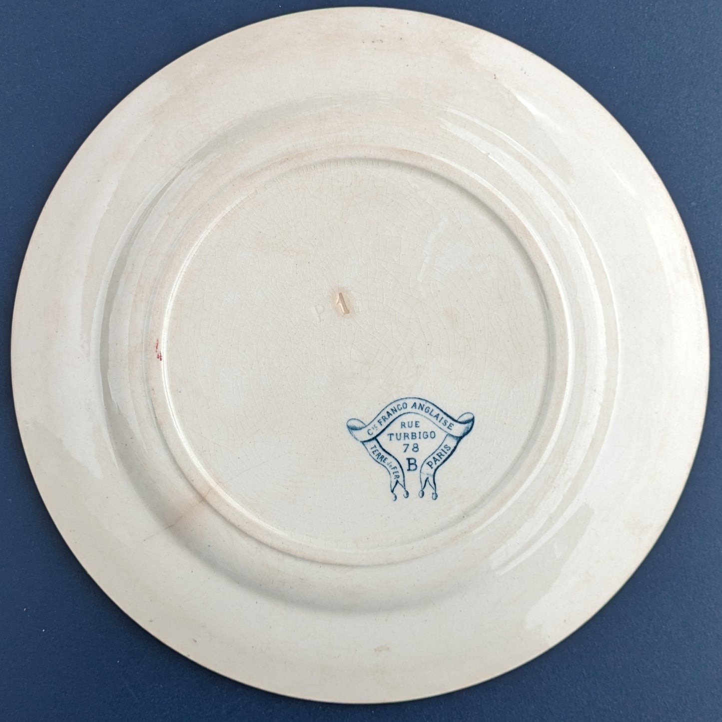 Antique ironware plate from the Franco-English Company in Paris